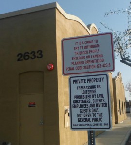 New sign: IT IS A CRIME TO TRY TO INTIMIDATE OR BLOCK PEOPLE ENTERING OR LEAVING PLANNED PARENTHOOD