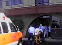 Ambulance takes injured woman away from abortion mill