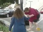 17 news report shows Terri Palmquist helping woman
