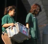 Crate filled with buckets of babies' bodies being carried away from Bakersfield's FPA abortion chamber.